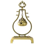 Vintage brass incense holder with intricate design.