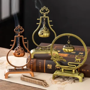 Decorative incense burners on a wooden table.