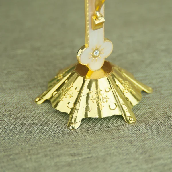 Ornate gold stand with floral design