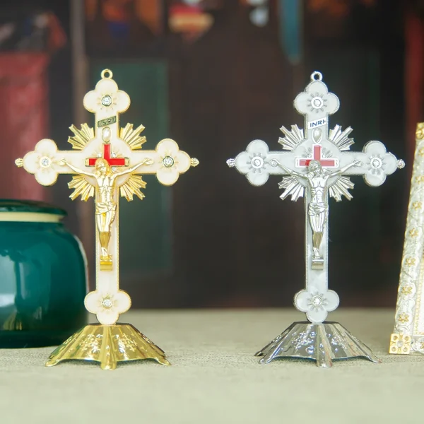 Gold and silver crucifixes on display table.