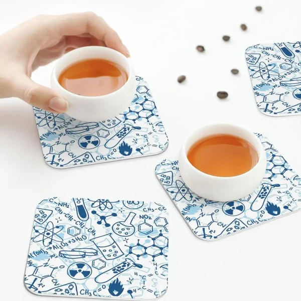 Tea cups on science-themed coasters.